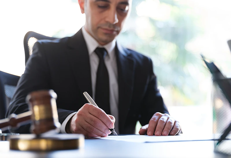 An attorney reviewing an errata sheet in his office
