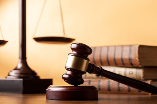 Courtroom Gavel and Law Books Representing the Importance of Accurate Legal Records in San Jose, CA 