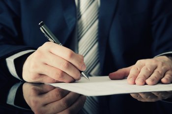 A man writing on paper