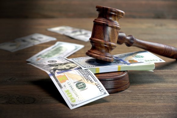 Court hammer striking money, accurate interpreting services in San Jose