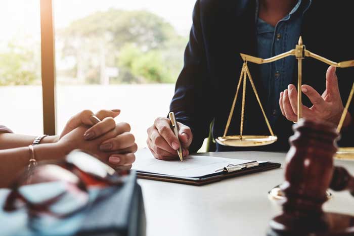 A girl talking to the lawyer