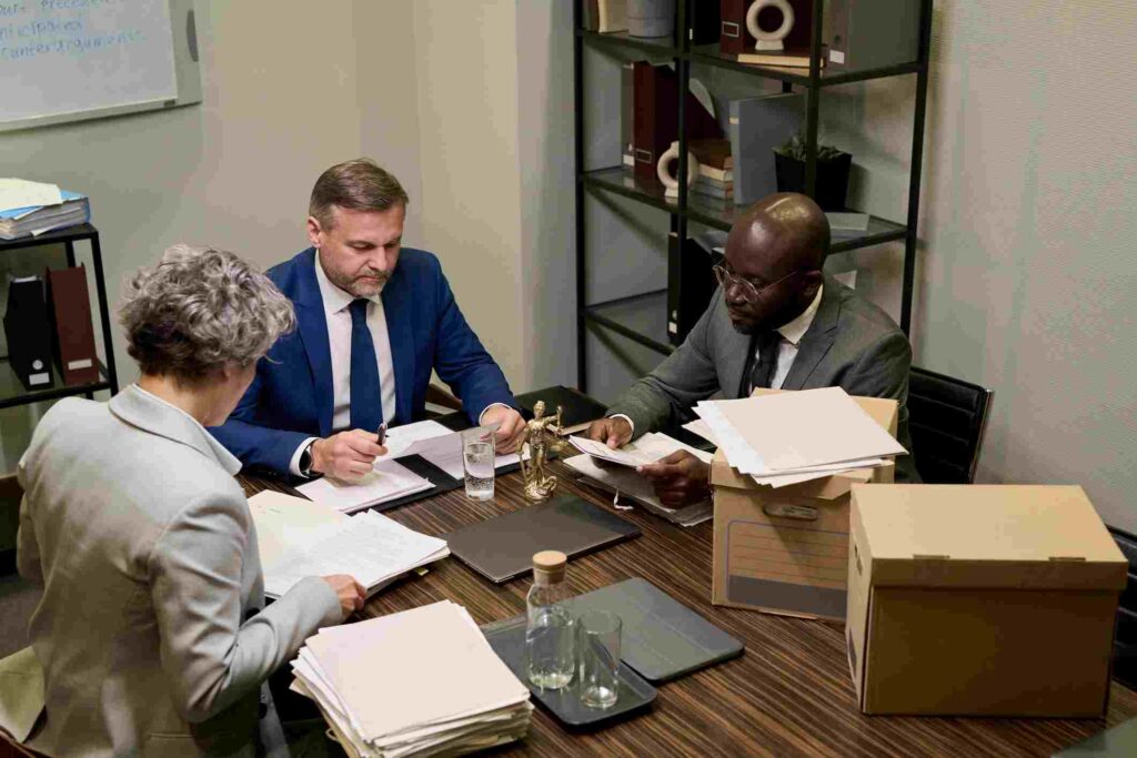 Professionals Working on Documents at a Meeting Table in San Jose, CA