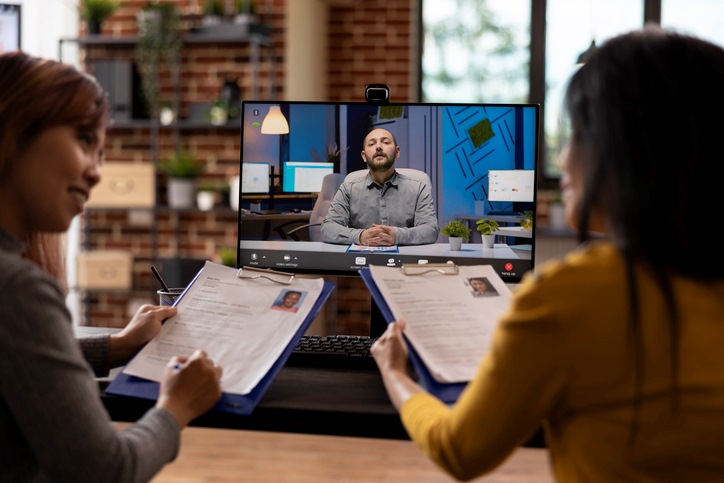 Remote Deposition in Progress With Video Conferencing and Paperwork in San Jose, CA