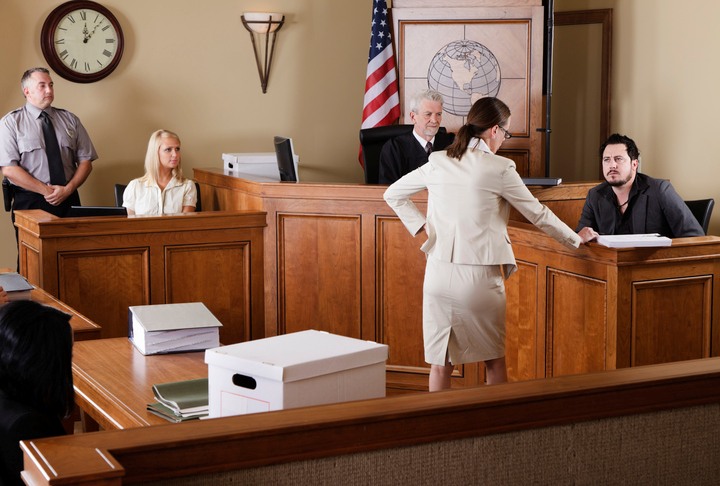Attorneys for legal proceedings presenting arguments in a courtroom in San Jose, CA.